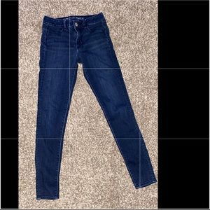 Dark blue jeans American eagle pants .